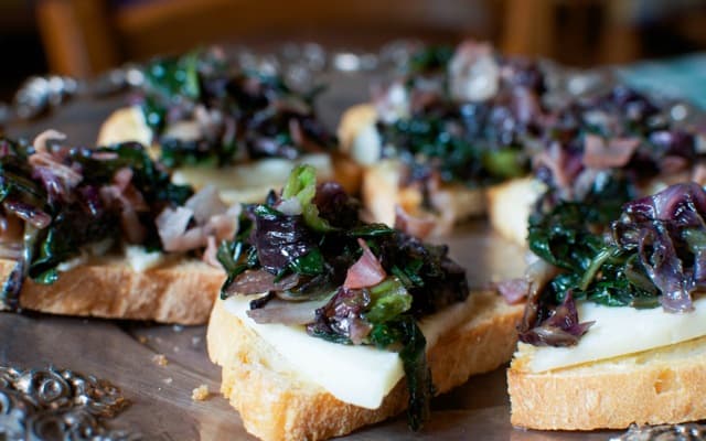 Savory Radicchio and Prosciutto Crostini Topped with Sweet Syrupy Sapa
