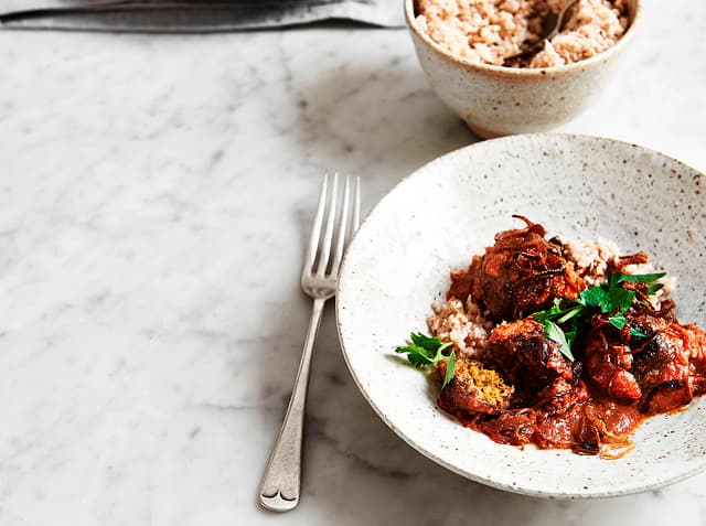 Middle Eastern–spiced walnut and white bean balls with cauliflower rice and fried onion