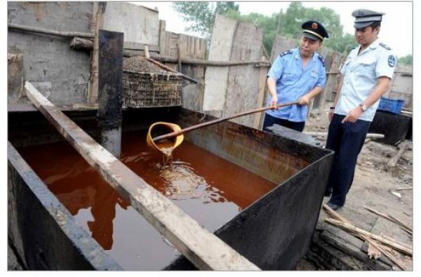 Police inspecting illegal cooking oil