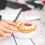 woman's hand holding donut