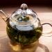 Green tea brewed in a teapot.